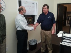 Jim Frank (Left) delivers the Spirit of Excellence Award to Russ Kiker (pictured right)