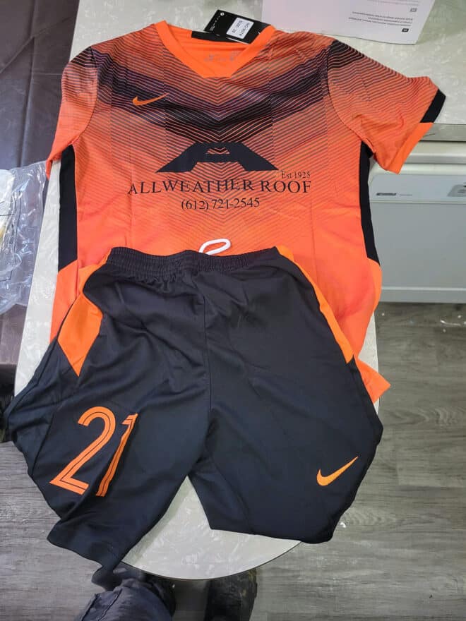 Soccer uniform featuring the Allweather Roof logo, showcasing the company's support for the sport of soccer.