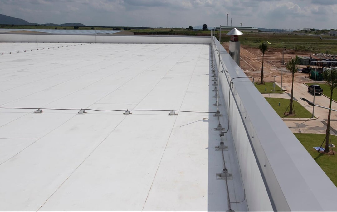 Commercial kitchens, such as restaurants, often release oils and fats through their ventilation systems. These can be harmful to many roofing materials. PVC, known for its resistance to chemicals, stands up well to these challenges, making it a top choice for such buildings.