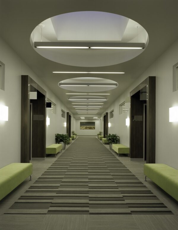 Skylights over office corridor. Benefits of skylight for commercial building